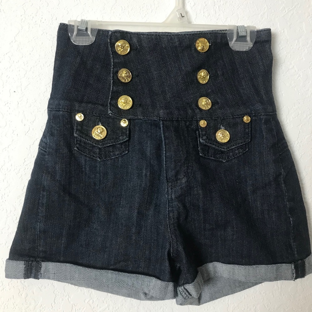 High waisted dark wash shorts with skull buttons